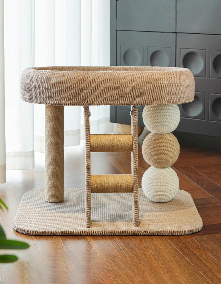 Compact cat tree with scratching post, platform, and cozy bed designed for small apartments