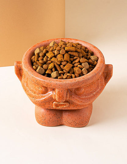 Elevated ceramic pet bowl in kiln-fired orange inspired by Sanxingdui mask design, supporting neck health for cats and dogs