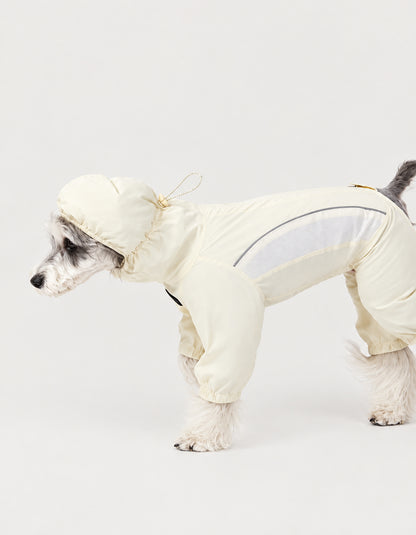 Small dog modeling the CHISUPET Sunveil butter yellow dog suit made with lightweight UPF 50+ fabric for outdoor sun protection