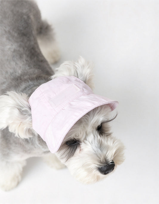 Lightweight waterproof dog sun hat with adjustable strap and streamlined brim. Breathable outdoor protection for everyday summer walks