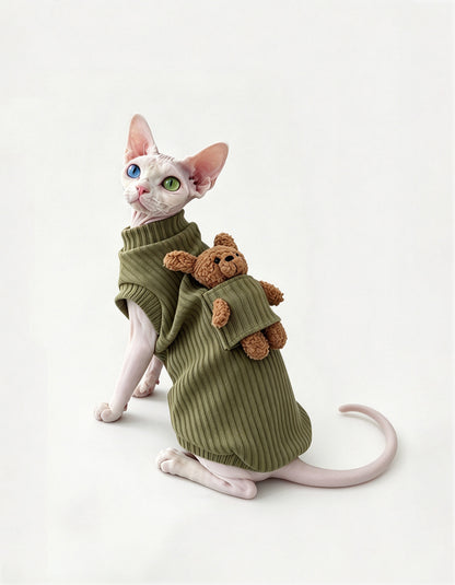 Devon Rex cat wearing a green cotton cat vest designed for lightweight warmth and comfortable everyday wear.