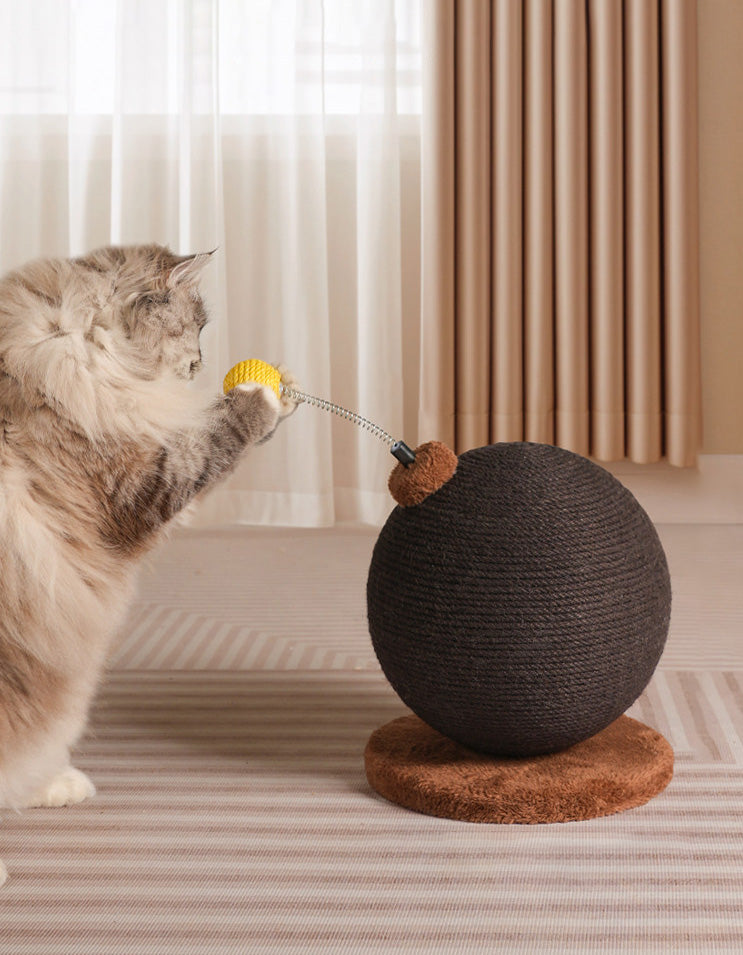 Cat actively scratching and interacting with novelty shaped cat scratch toy