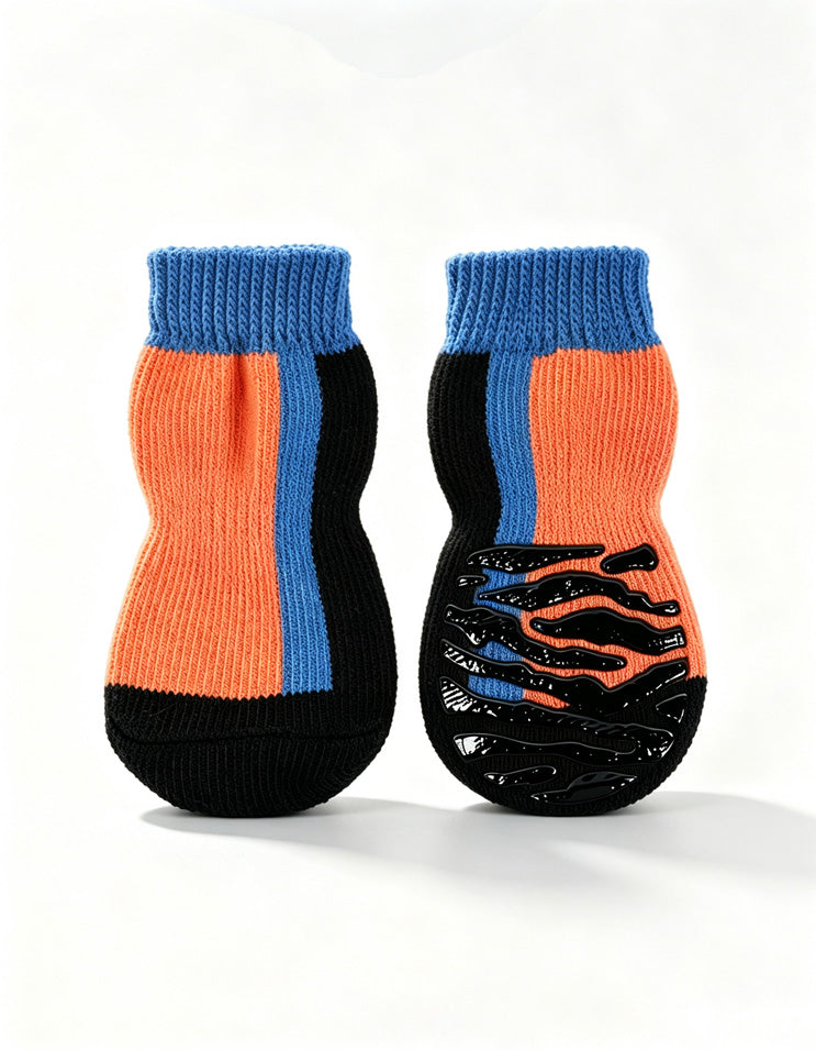 Orange non-slip dog socks with breathable combed cotton construction and flexible grip sole for dogs.