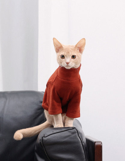 Orange kitten wearing the CHISU CloudSoft antibacterial turtleneck base layer for lightweight warmth.