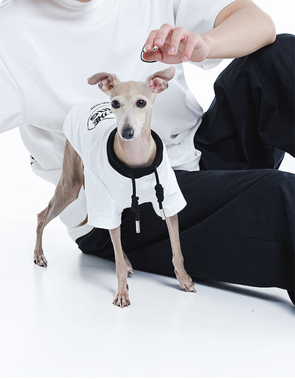 Dog and owner wearing the CHISUPET Dad & Me Cotton Set matching cotton T-shirts during an outdoor walk