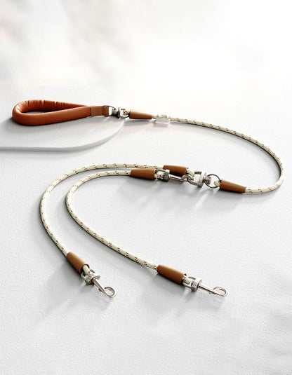 Two-dog leash with multi-point swivel joints preventing tangling during walks