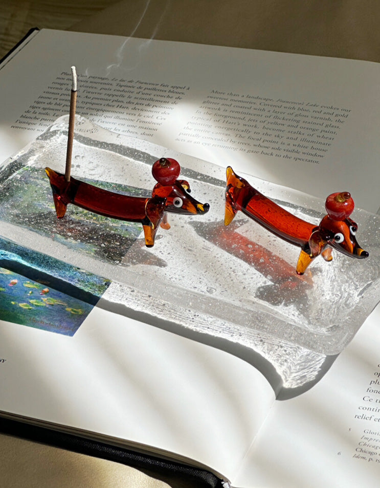 Glass dachshund incense holder with smooth translucent finish, perfect for home fragrance and decor