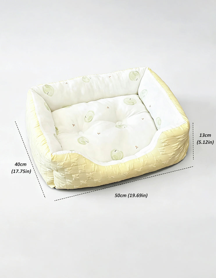 Green apple shaped cooling pet bed featuring soft PP cotton filling and a non-slip bottom