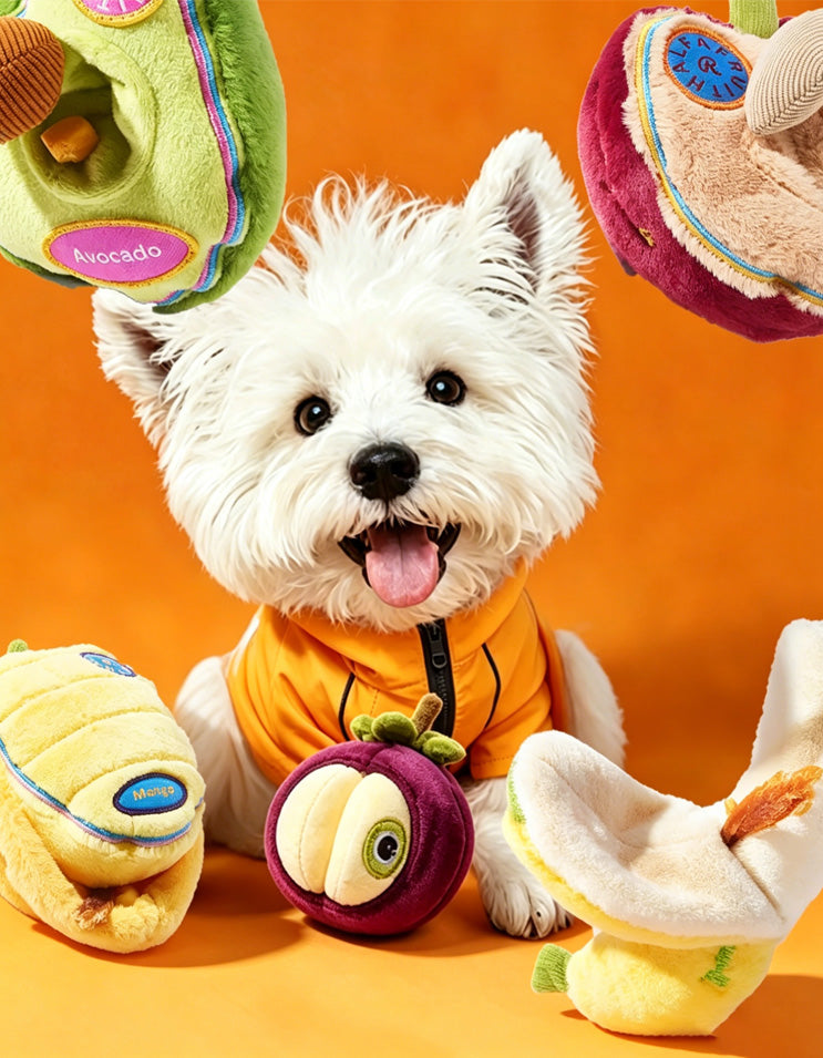 Small dog playing with fruit-themed enrichment toys designed for sniffing and stress relief