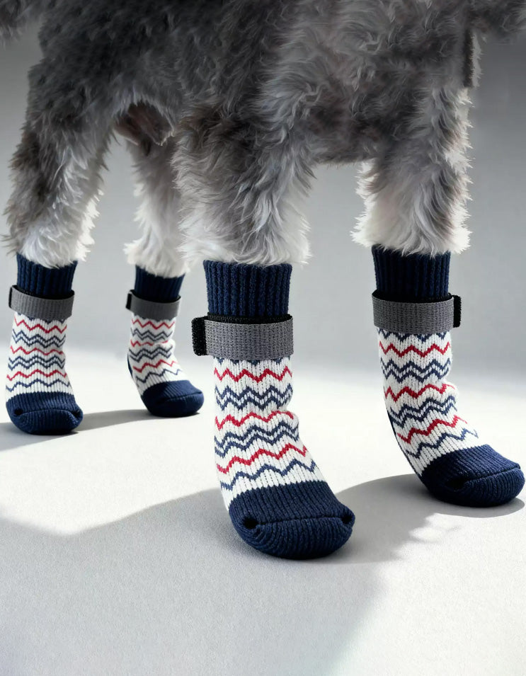 Dog wearing long cotton dog socks designed to keep paws warm, improve traction, and prevent slipping on smooth indoor floors.