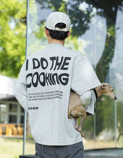Man and dog wearing matching Dad & Me cotton T-shirts while enjoying quality time together