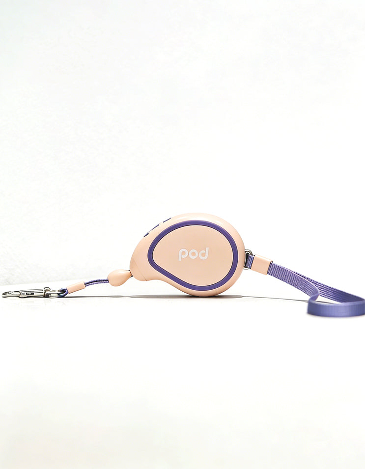 Pink retractable leash designed for small dogs and cats with lightweight build
