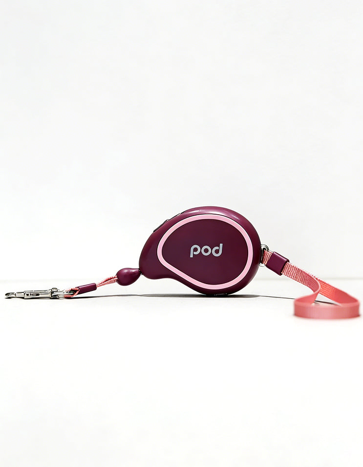 Purple retractable dog leash with compact body and automatic extension system