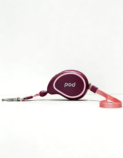 Purple retractable dog leash with compact body and automatic extension system