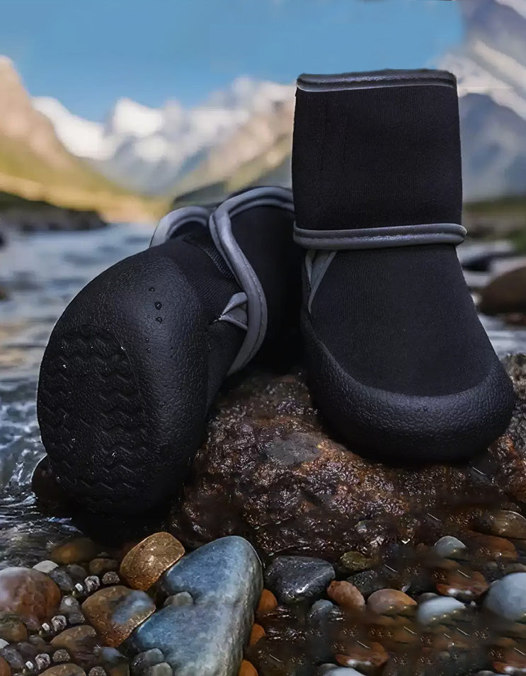 Close-up of dog water shoes splashing through shallow water with flexible anti-slip sole