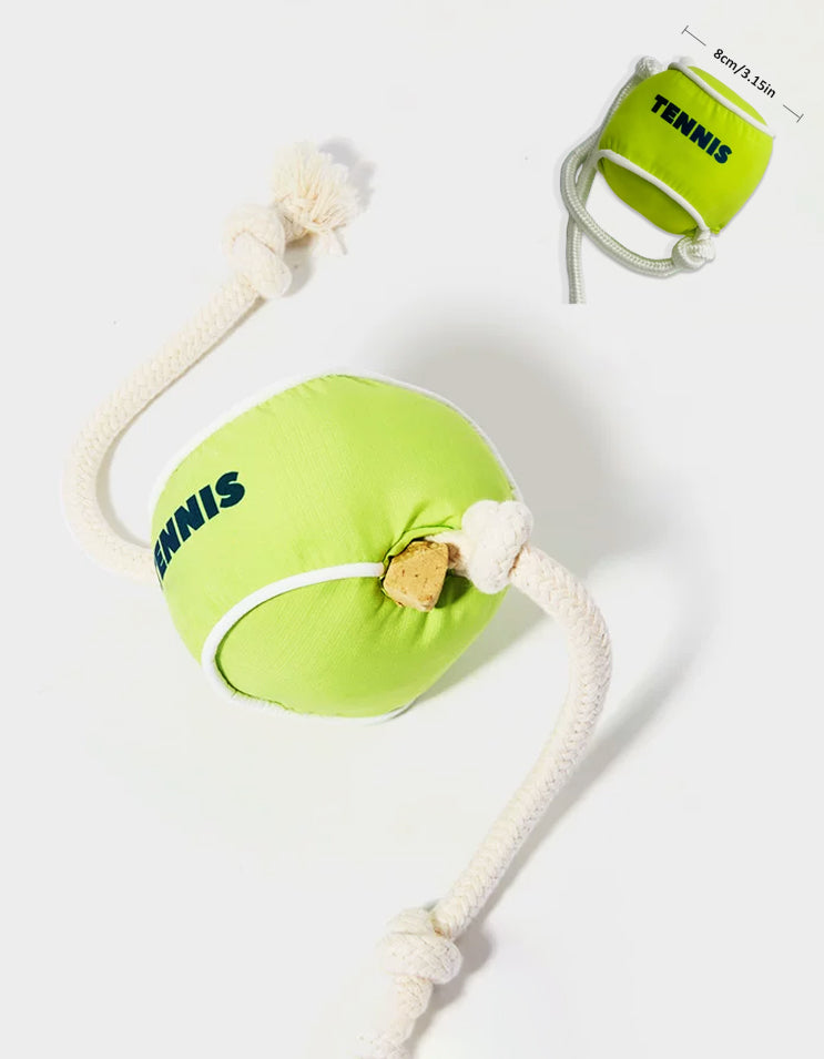 Tennis ball shaped snuffle toy with rope handle for dogs and cats, designed for treat hiding and interactive play