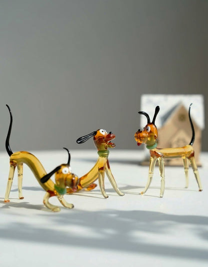 Three handcrafted liuli glass dog figurines in different poses, a playful and artistic home decor set