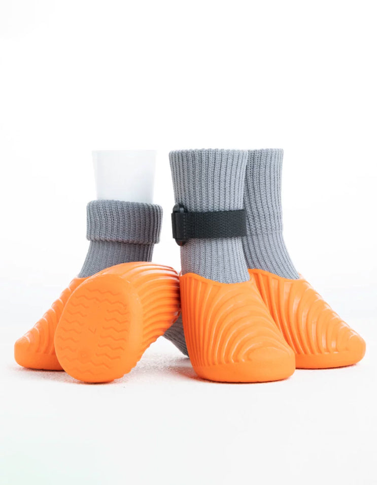 Orange and gray waterproof dog boots featuring flexible sock-fit construction