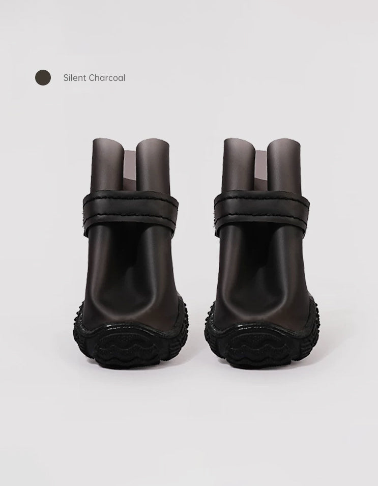 Silent Charcoal StormGrip dog rain boots featuring a wide toe design, secure closure system, and durable waterproof construction.