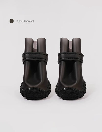 Silent Charcoal StormGrip dog rain boots featuring a wide toe design, secure closure system, and durable waterproof construction.