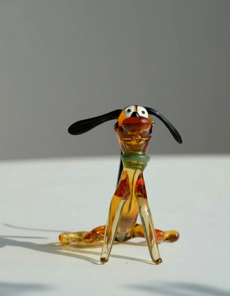 Handcrafted liuli glass dog figurine in a relaxed sitting pose, charming and cozy home decor