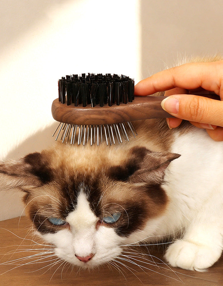 Wooden handle slicker brush designed to remove knots and loose fur from long-haired cats