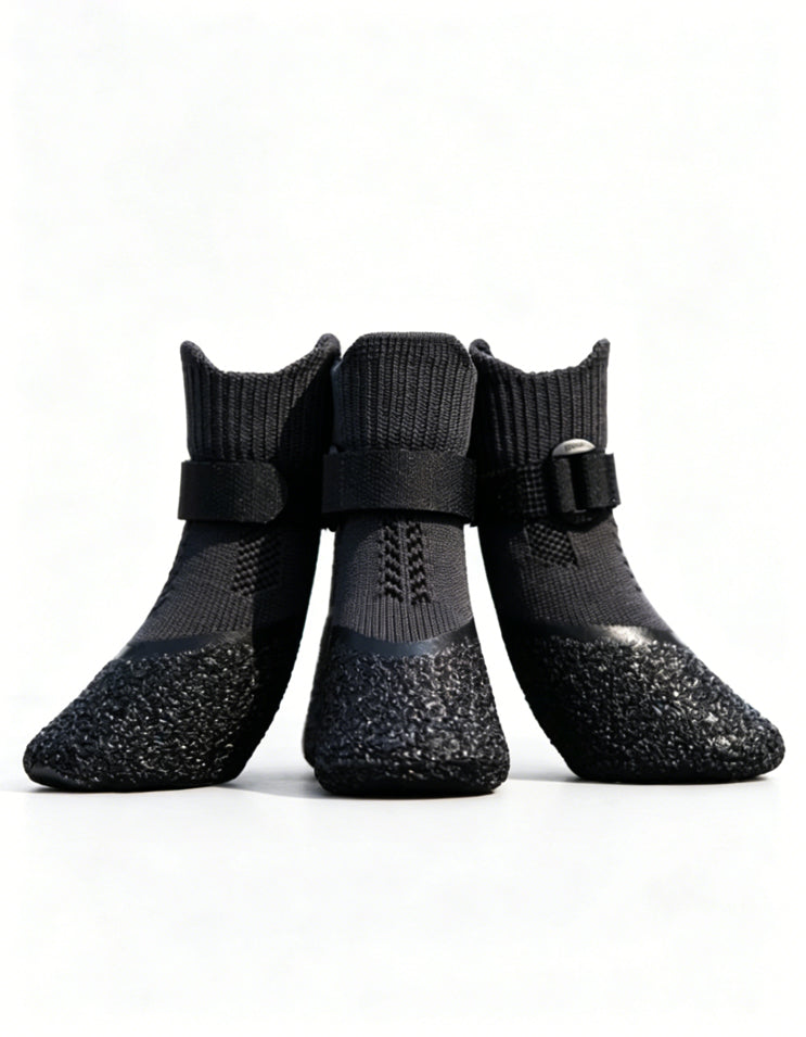 Black anti-slip dog boots with segmented strap system and natural latex sole